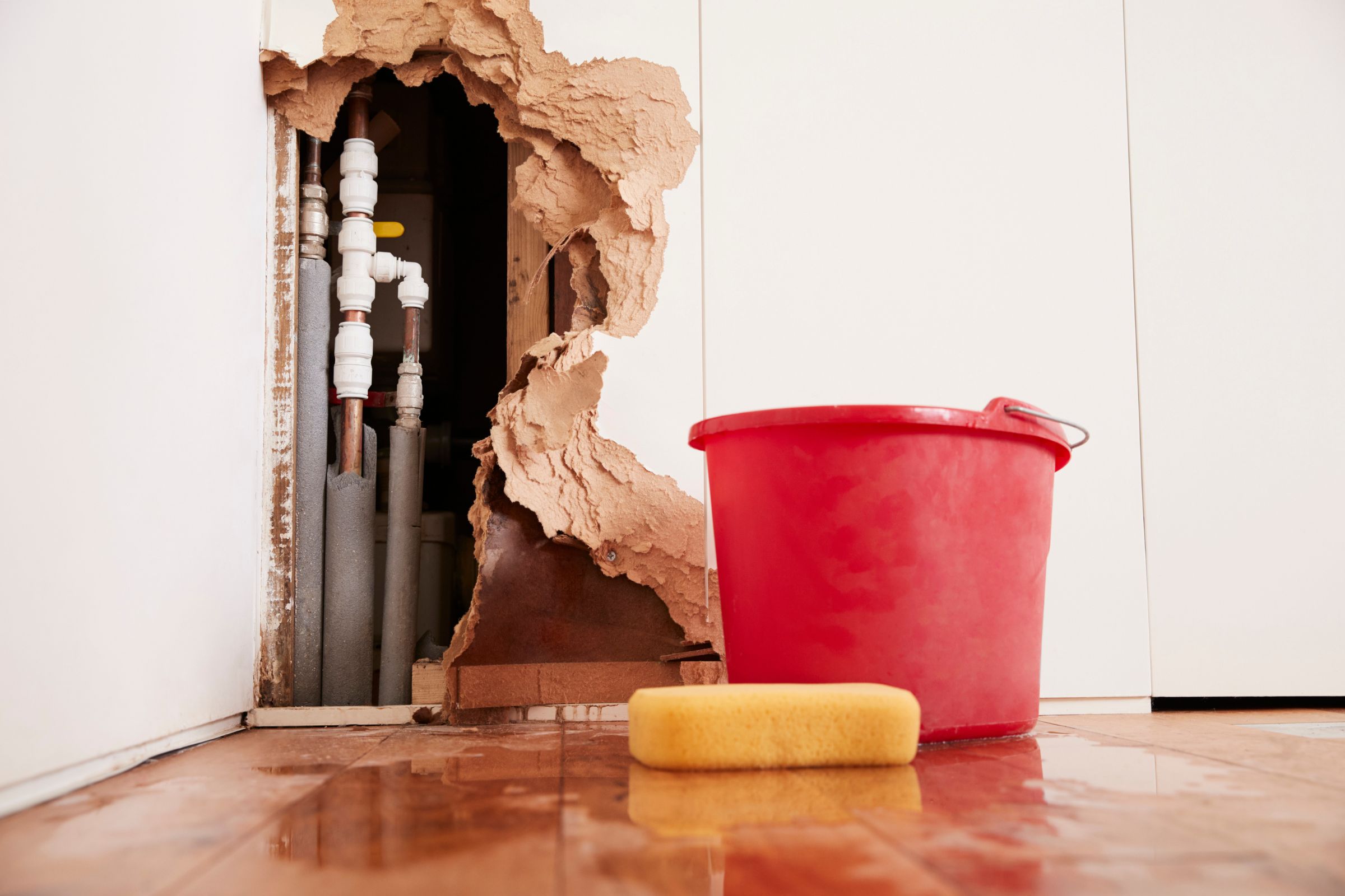 wall damage caused by water damage getting cleaned up